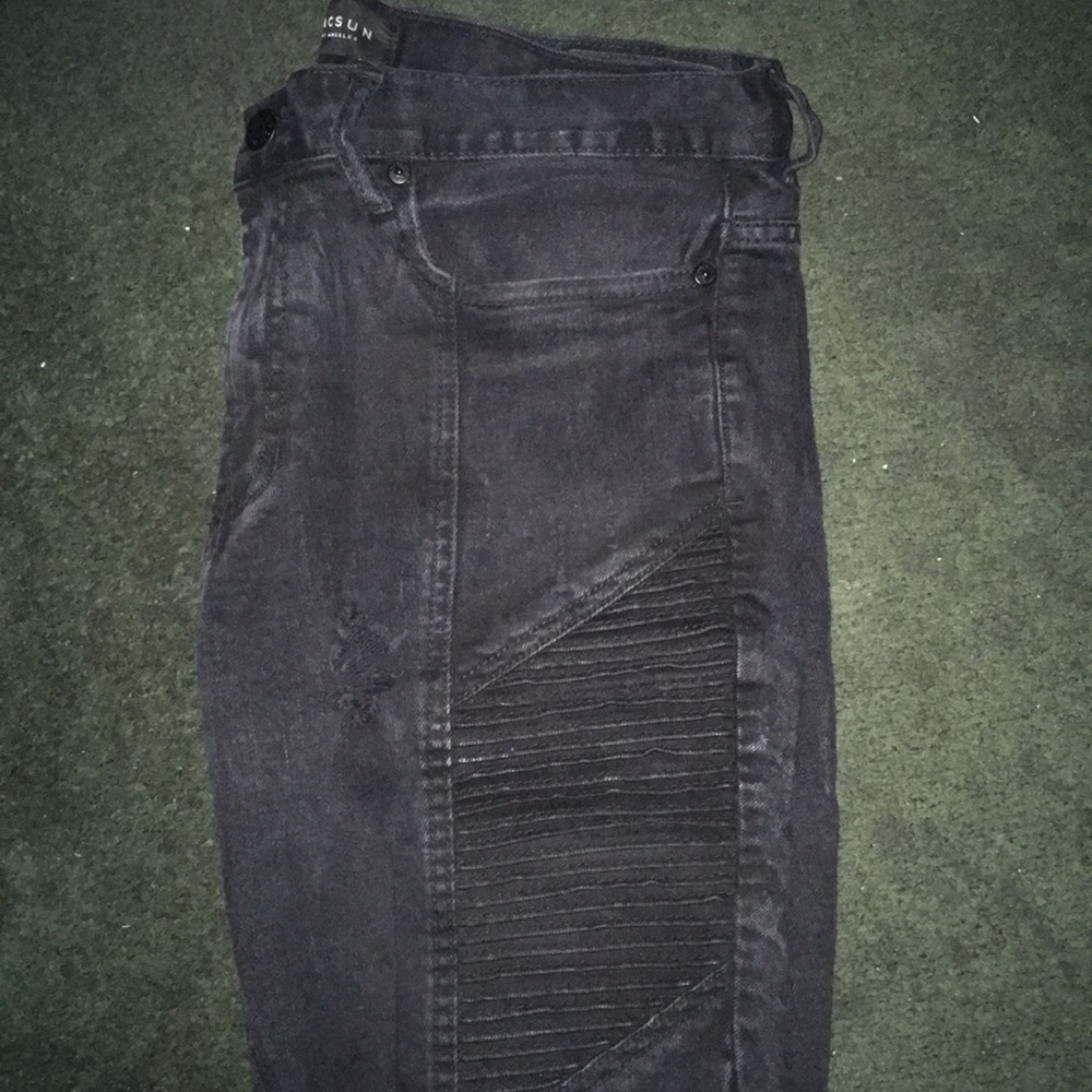 Black distressed moto jeans